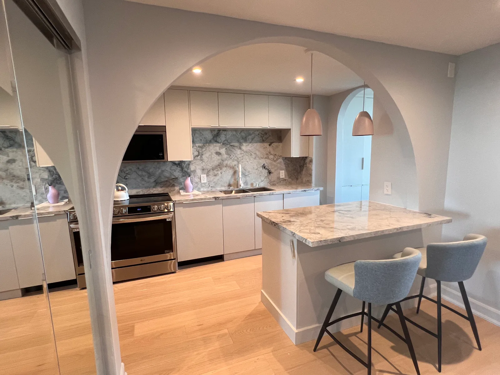 Completed kitchen island and arched opening at 3000 Bathurst