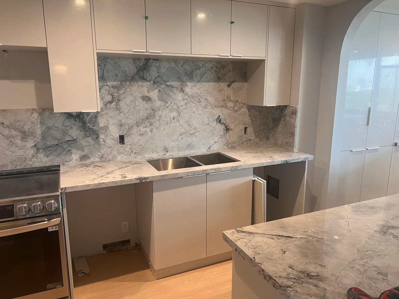 Completed marble-look kitchen counter and backsplash at 3000 Bathurst