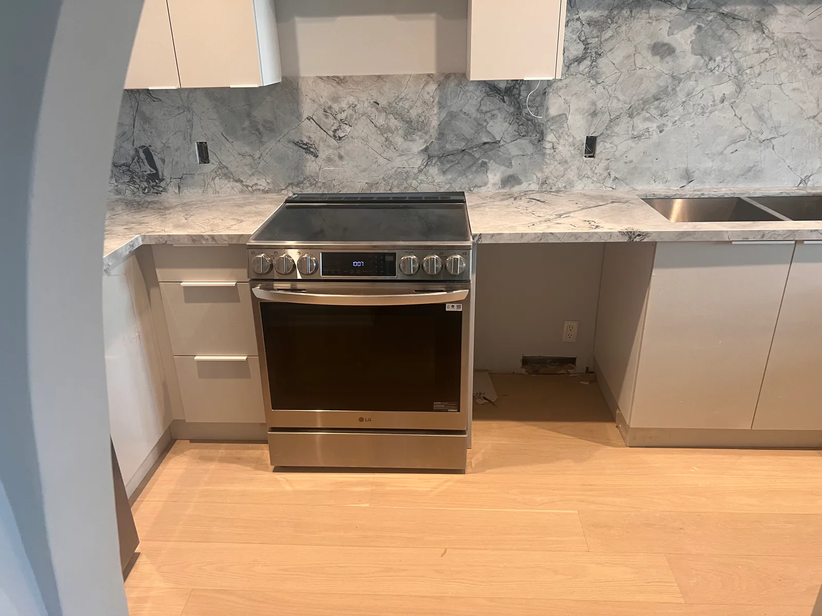 Completed range wall and kitchen floor at 3000 Bathurst