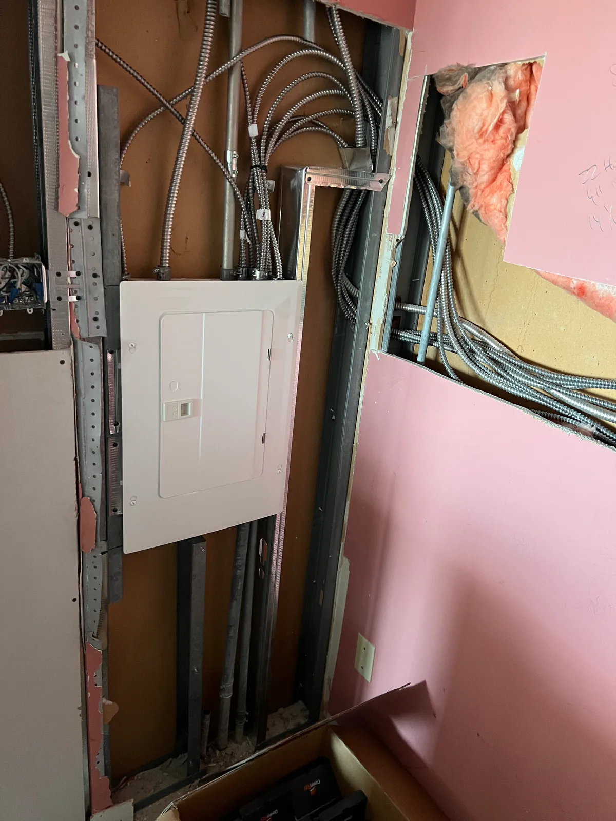 Electrical panel and rough wiring inside the renovation walls at 3000 Bathurst