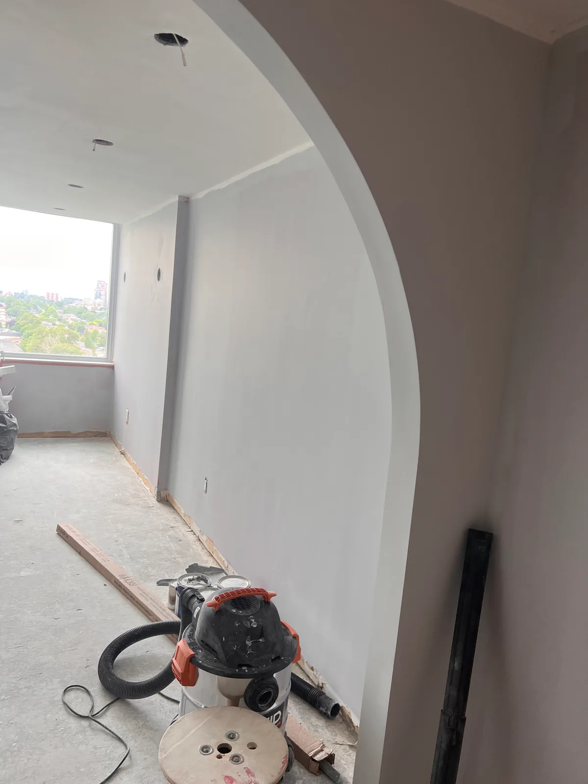 Renovated room during ceiling and wall preparation with window view at 3000 Bathurst