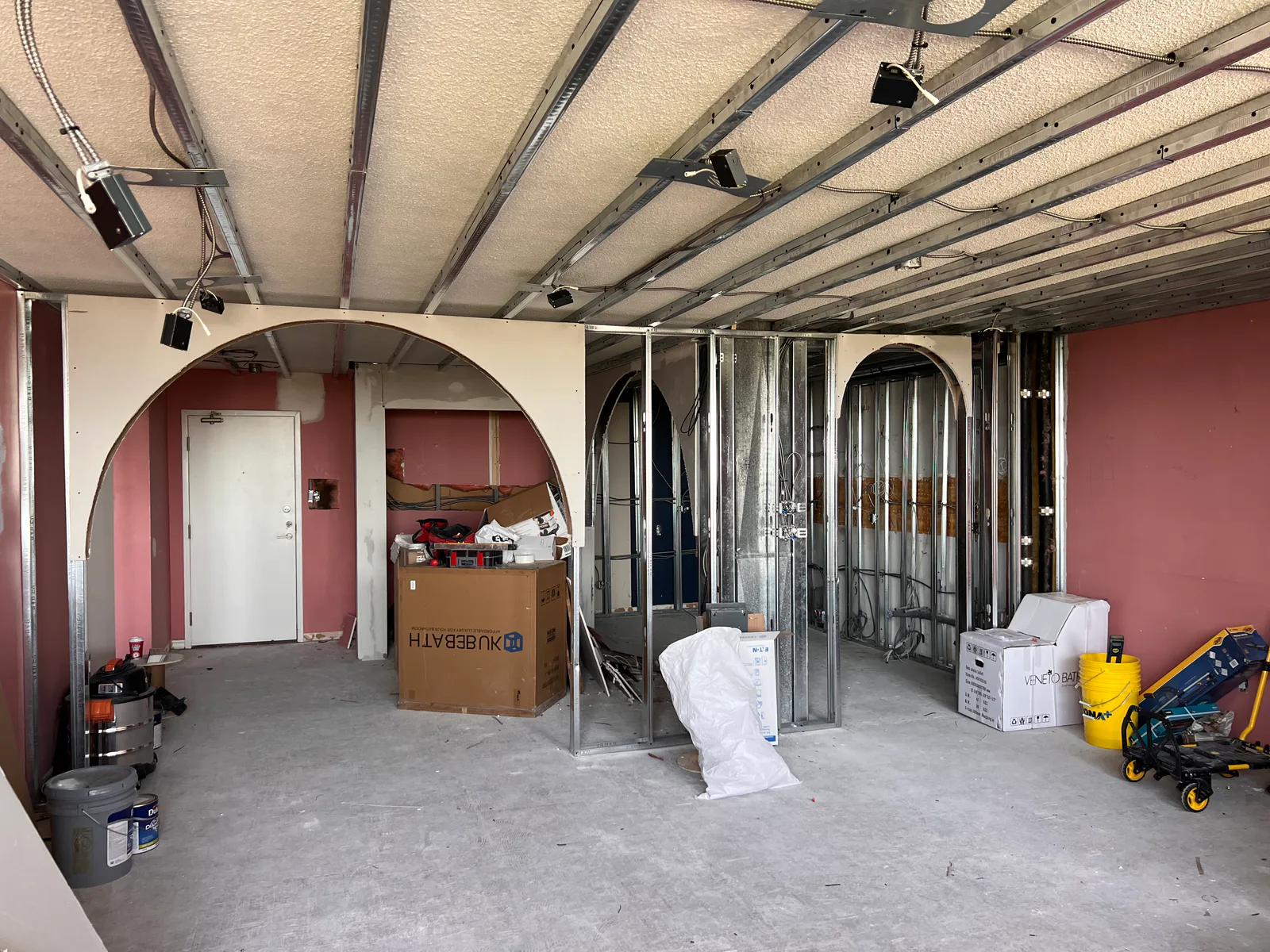 Renovation work area with arched wall framing and ceiling services at 3000 Bathurst