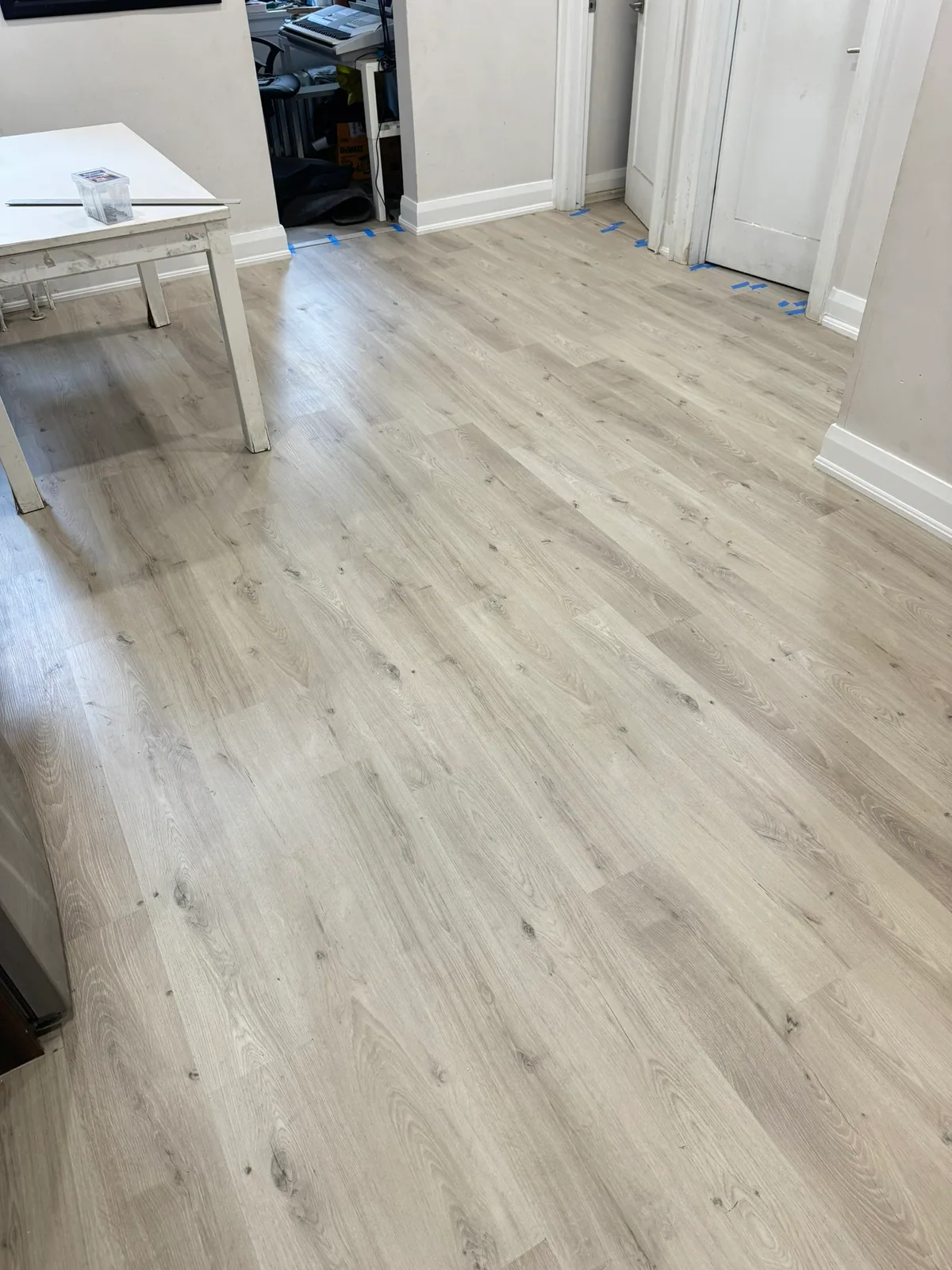 New flooring installed around multiple doorways and wall transitions