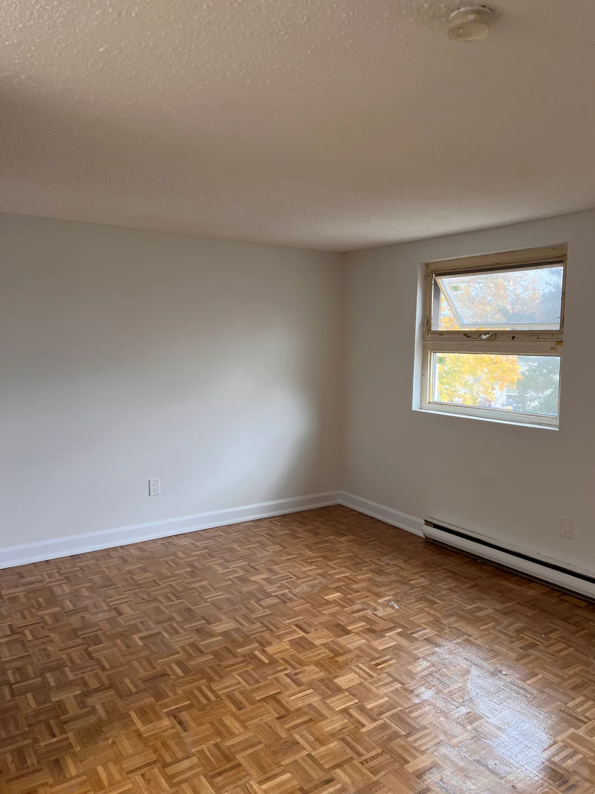 Finished Goreway condo interior with parquet floor and light painted walls