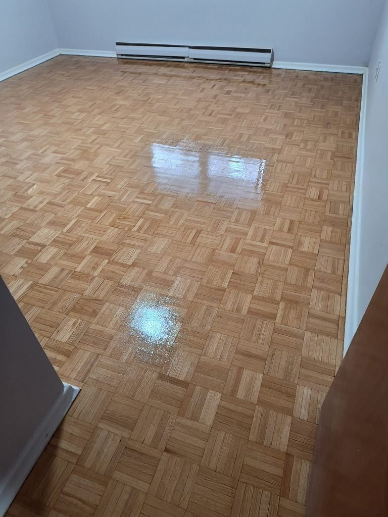 Completed sanded and finished parquet floor viewed from a bedroom doorway