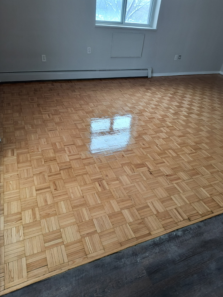 Completed Hamilton parquet floor showing uniform restored sheen