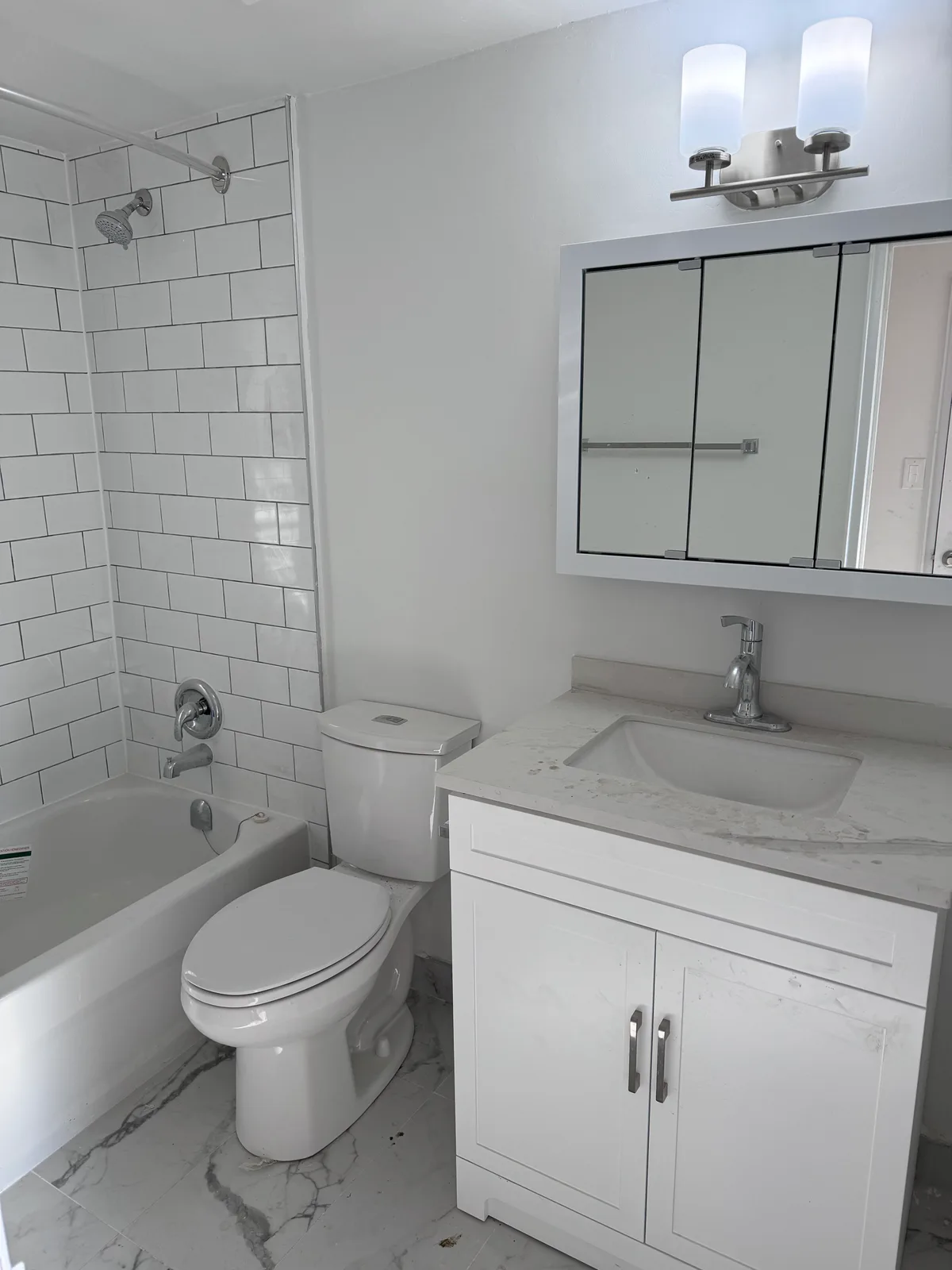 Completed bathroom with subway tile and vanity at Kingsbridge, Bathurst