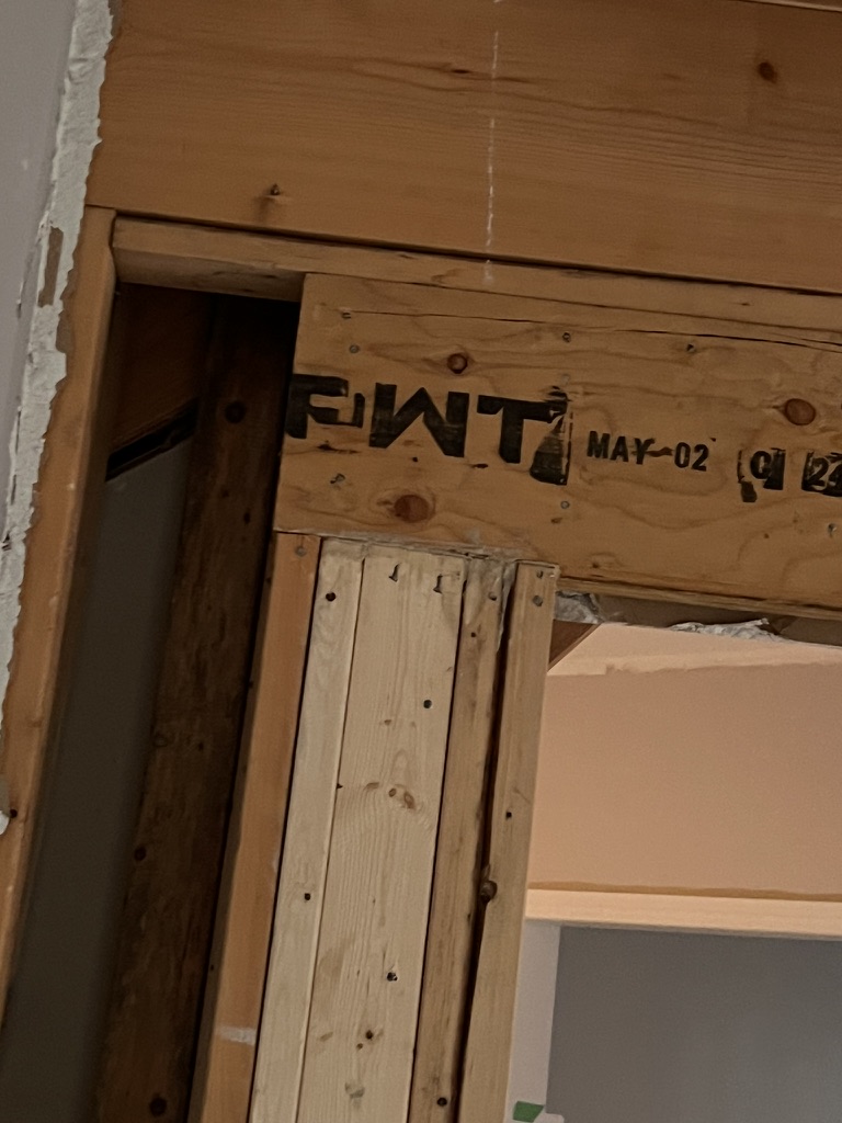 Close view of header framing and supporting studs