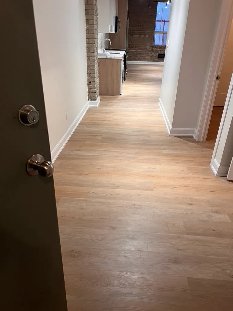 Completed 34 Noble hallway with continuous new flooring